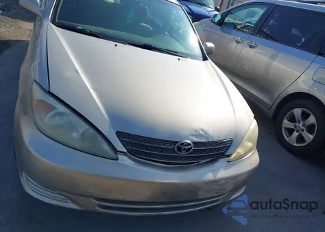 2003 Toyota Camry Le from USA, damaged, VIN 4T1BE32KX3U181028